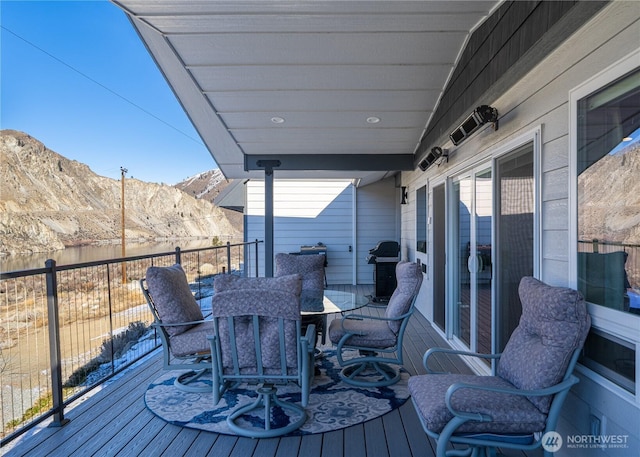 deck featuring grilling area and a mountain view