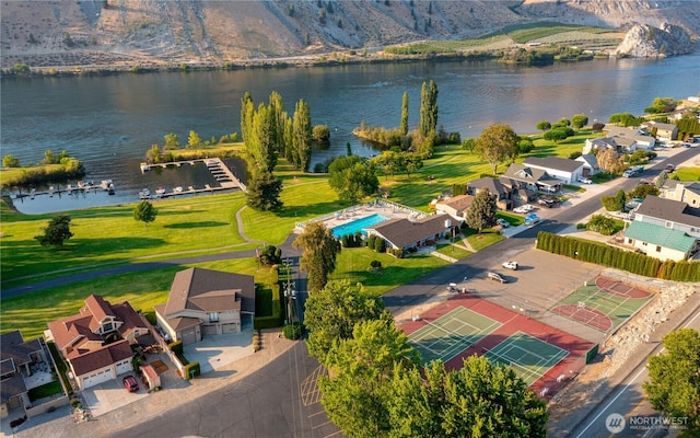 bird's eye view with a residential view and a water view