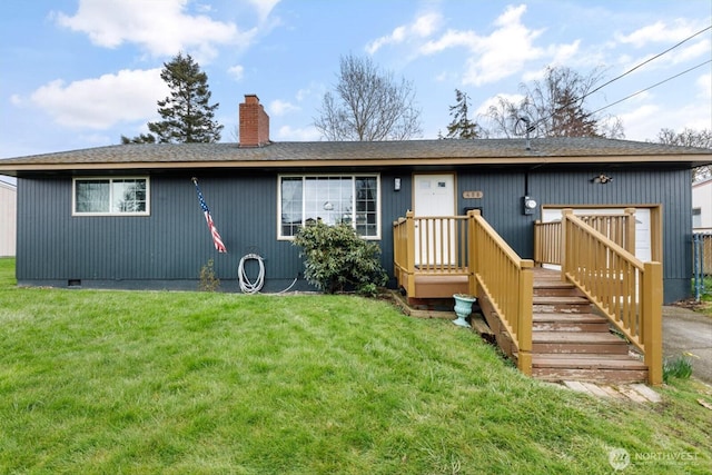 back of house with crawl space, a lawn, and a chimney