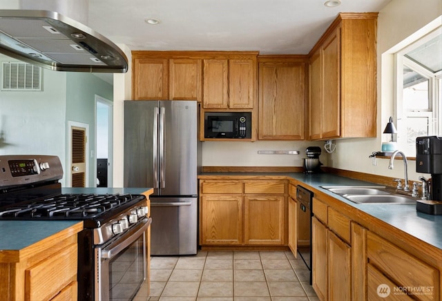 kitchen featuring visible vents, wall chimney exhaust hood, black appliances, a sink, and light tile patterned flooring