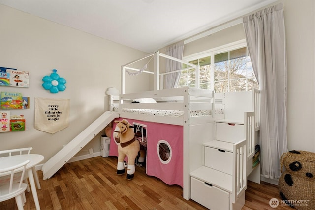 bedroom featuring light wood-style flooring and baseboards