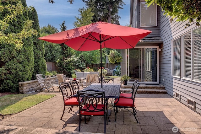 view of patio / terrace featuring fence and outdoor lounge area