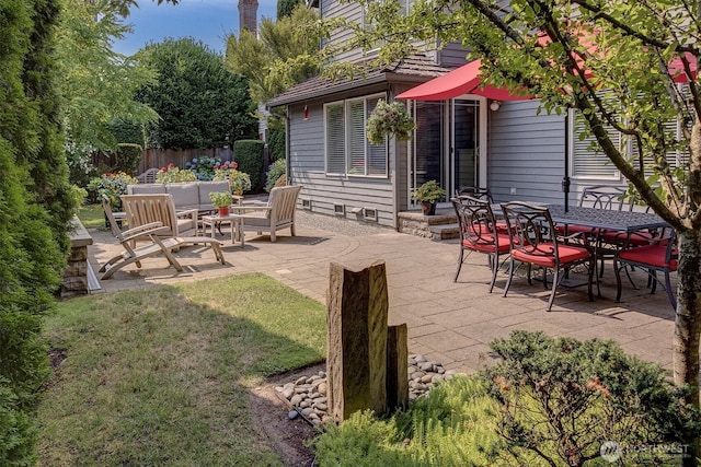 view of patio / terrace featuring outdoor lounge area and fence