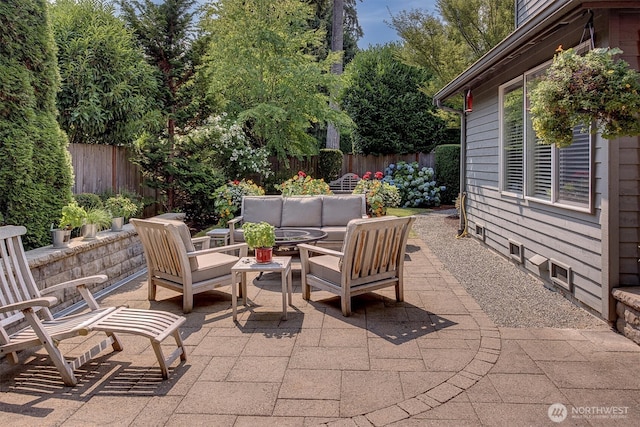 view of patio featuring a fenced backyard and an outdoor living space