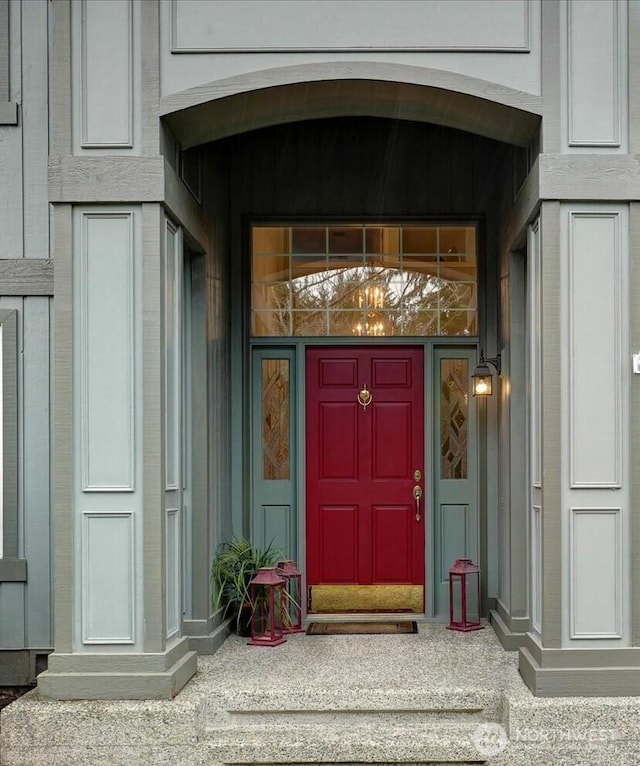 entrance to property featuring board and batten siding