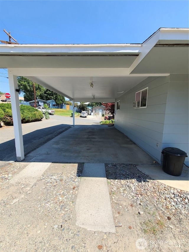 view of vehicle parking with an attached carport