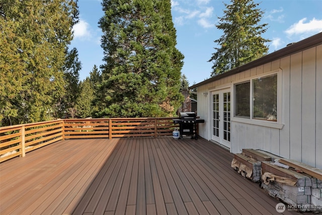 wooden terrace with grilling area and french doors