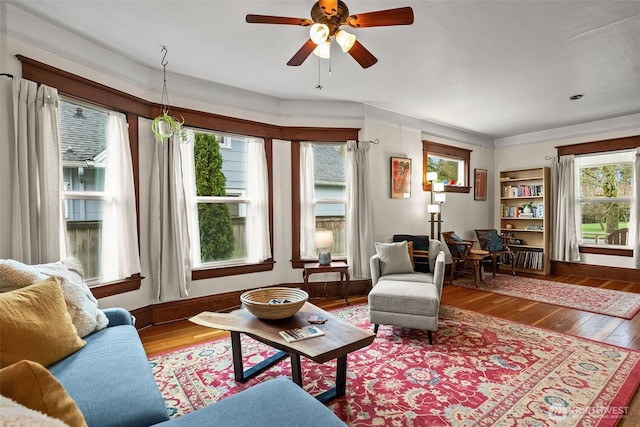 living room with hardwood / wood-style floors and ceiling fan