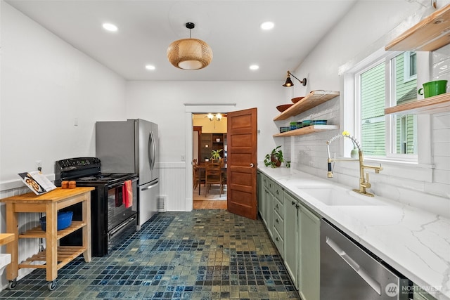 kitchen with recessed lighting, appliances with stainless steel finishes, open shelves, and a sink