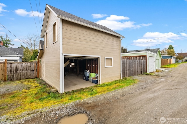 garage with fence