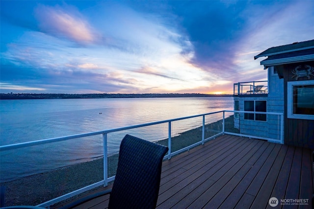 wooden deck featuring a water view