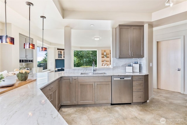 kitchen featuring a sink, backsplash, light stone countertops, dishwasher, and decorative light fixtures