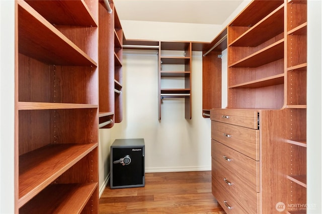 spacious closet with wood finished floors