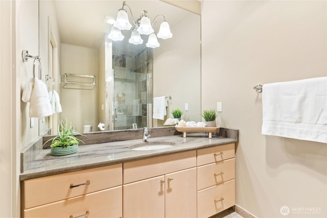 full bath featuring a chandelier, toilet, a shower stall, and vanity