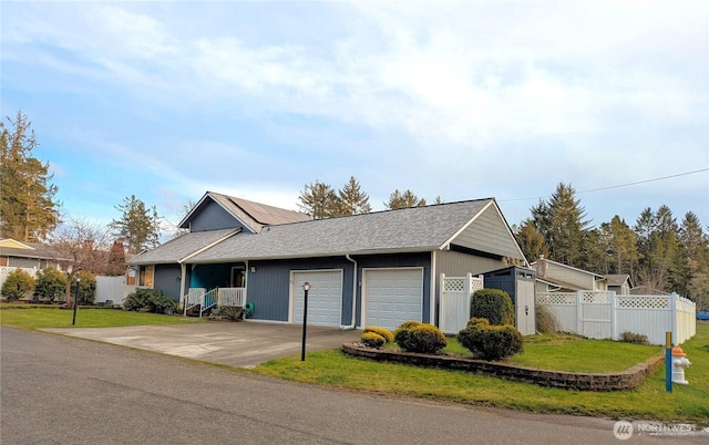 ranch-style house with solar panels, an attached garage, a front yard, fence, and driveway