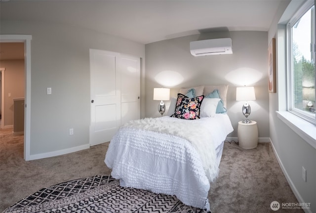 carpeted bedroom featuring a wall unit AC and baseboards