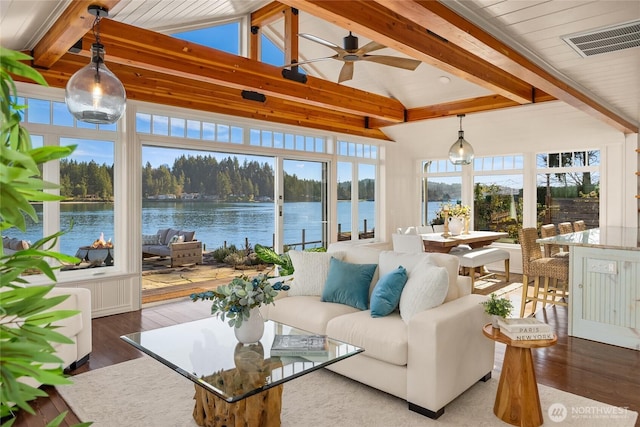 sunroom with lofted ceiling with beams, a water view, visible vents, and a ceiling fan