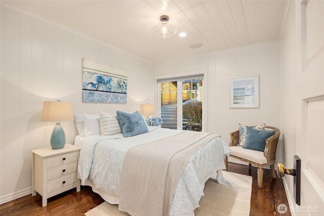 bedroom featuring access to exterior, dark wood-style flooring, and crown molding