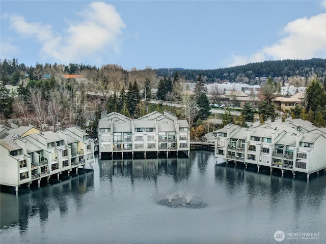 bird's eye view featuring a water view and a residential view