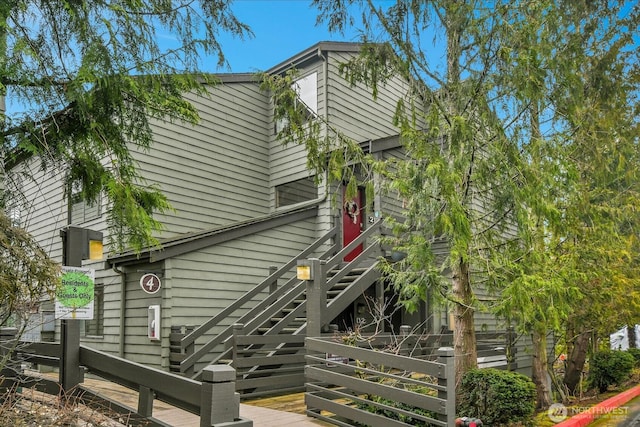 view of home's exterior featuring stairs