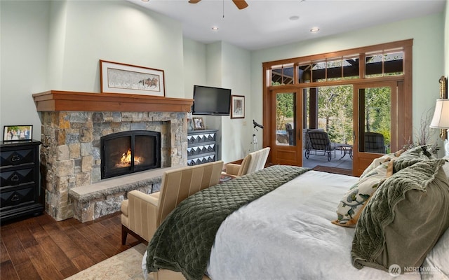 bedroom with recessed lighting, a fireplace, a ceiling fan, access to outside, and wood-type flooring