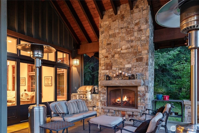 view of patio with an outdoor living space with a fireplace and a grill