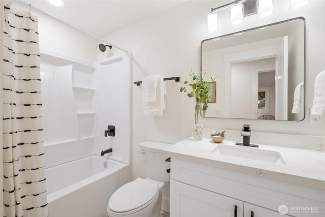 full bathroom featuring shower / tub combo with curtain, vanity, and toilet