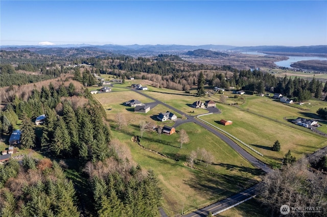 aerial view featuring a wooded view