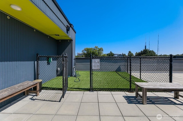 exterior space featuring fence and a gate