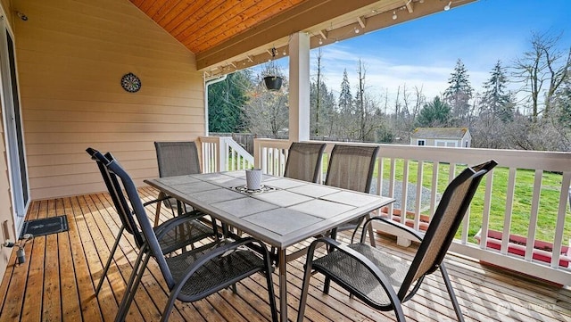 wooden terrace with outdoor dining space