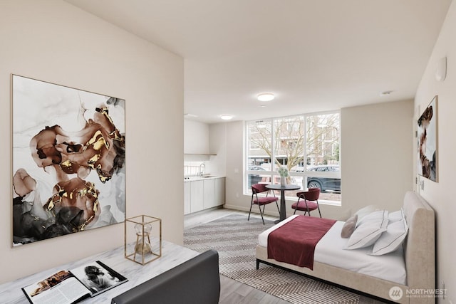 bedroom with light wood-type flooring