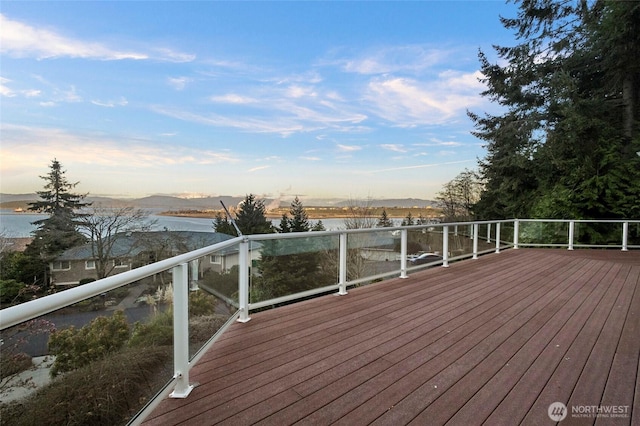 wooden deck featuring a water view