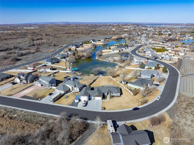 aerial view with a residential view and a water view