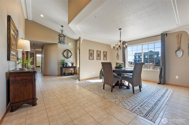 dining area with light tile patterned floors, baseboards, vaulted ceiling, a textured ceiling, and a chandelier