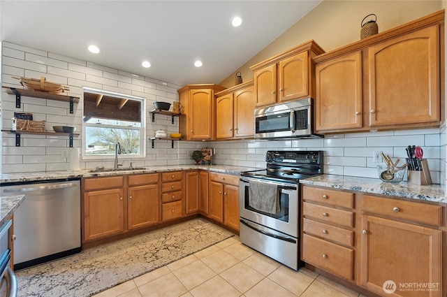 kitchen with light tile patterned flooring, a sink, appliances with stainless steel finishes, open shelves, and tasteful backsplash