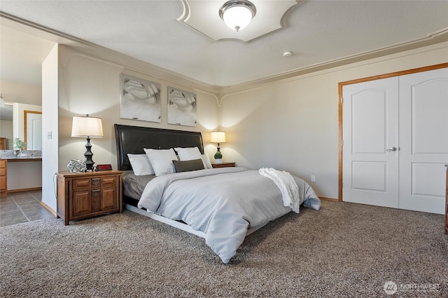 bedroom featuring carpet flooring and baseboards