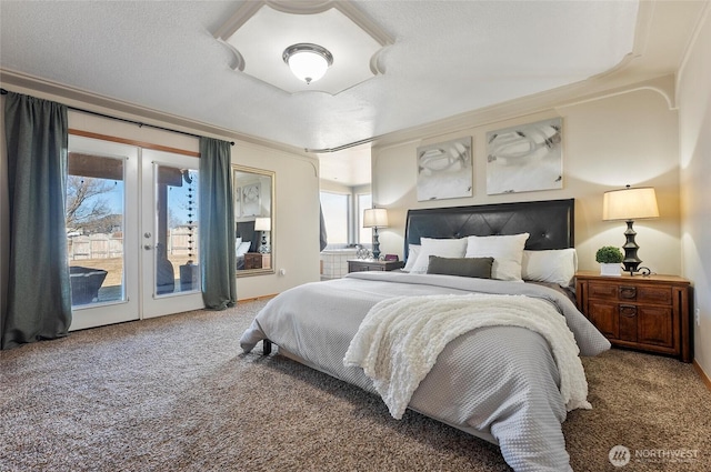 bedroom featuring access to outside, french doors, a textured ceiling, and carpet