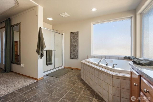 full bath with baseboards, a shower stall, vanity, and a bath