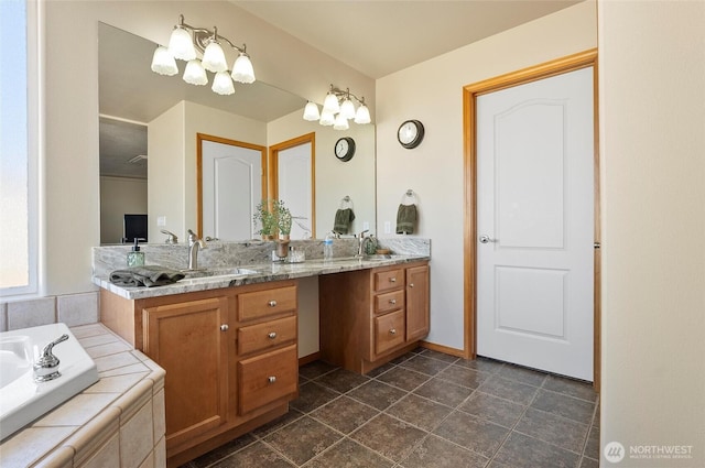 bathroom with a relaxing tiled tub, a sink, and double vanity