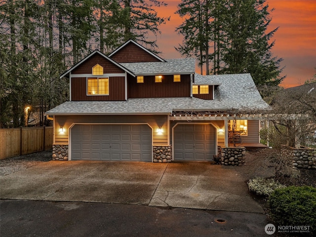 22426 SE 300th St, Black Diamond, WA 98010 - view of front of home with stone siding, fence, driveway, and roof with shingles