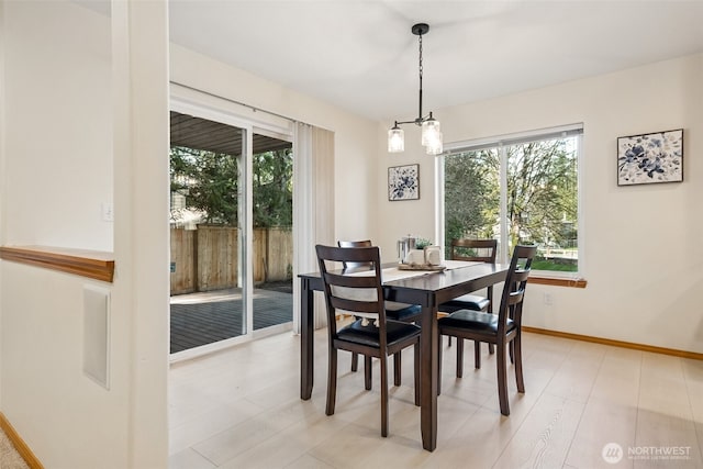 22426 SE 300th St, Black Diamond, WA 98010 - dining room featuring baseboards and light wood-type flooring