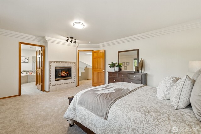 22426 SE 300th St, Black Diamond, WA 98010 - carpeted bedroom with a multi sided fireplace, ornamental molding, and ensuite bath