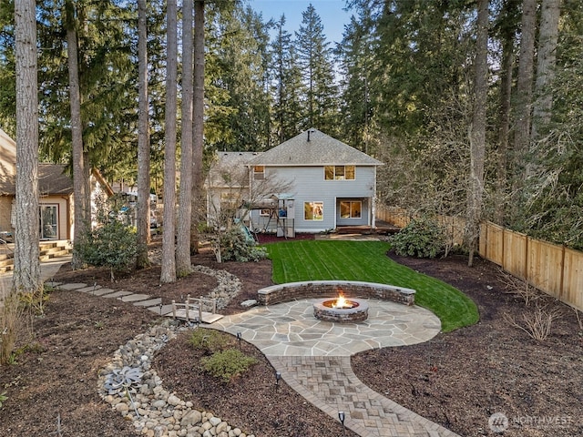22426 SE 300th St, Black Diamond, WA 98010 - rear view of house with a lawn, fence, a patio, and an outdoor fire pit