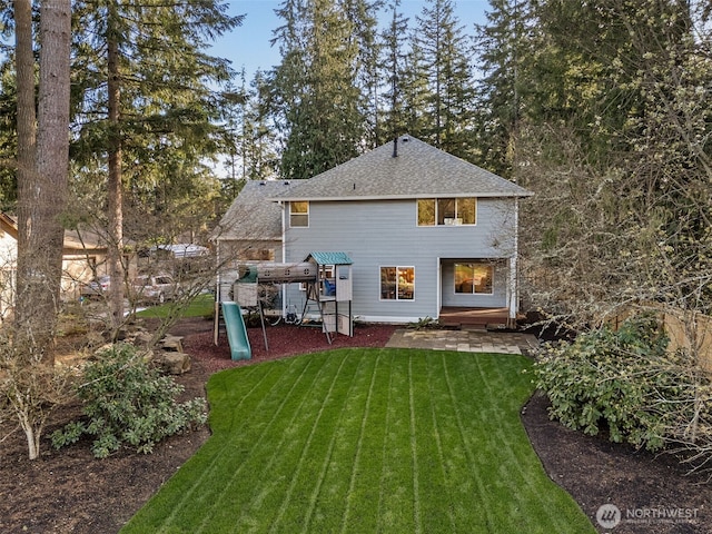 22426 SE 300th St, Black Diamond, WA 98010 - rear view of house featuring a playground and a lawn