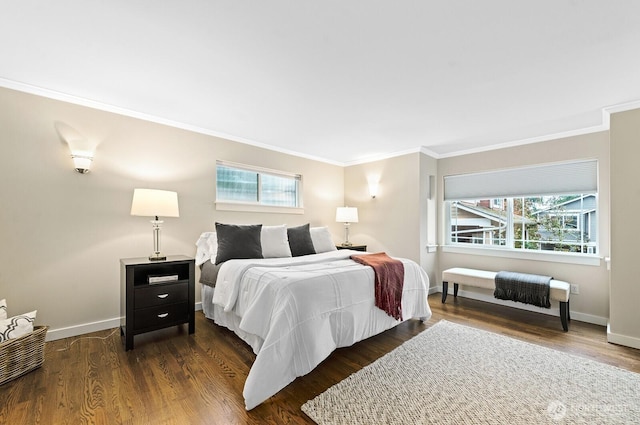 bedroom featuring multiple windows, dark wood-style flooring, and baseboards