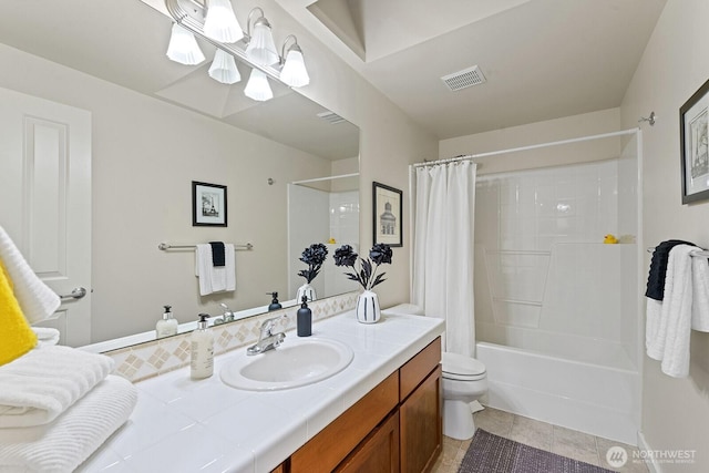 full bathroom featuring tile patterned flooring, toilet, vanity, visible vents, and shower / bath combination with curtain