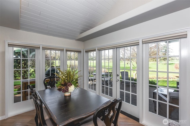 sunroom featuring french doors and vaulted ceiling