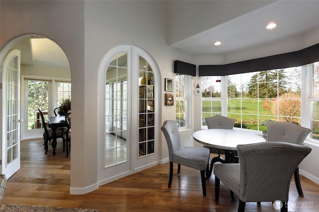 dining area with french doors, recessed lighting, hardwood / wood-style flooring, and baseboards