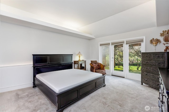 bedroom with access to outside, baseboards, vaulted ceiling, and light colored carpet