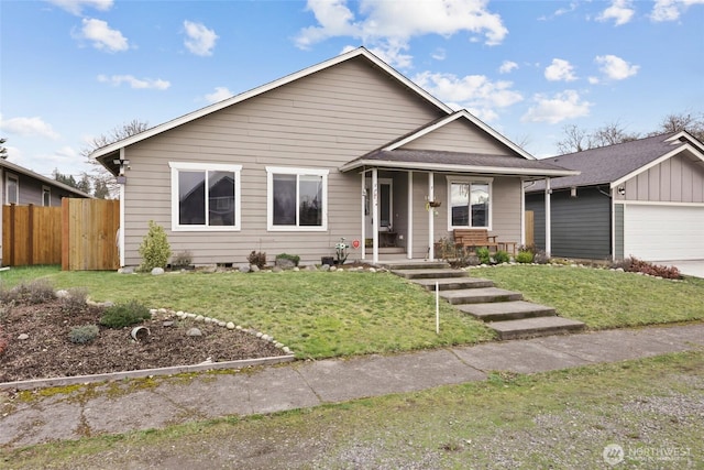 view of front of home featuring fence, a porch, and a front yard